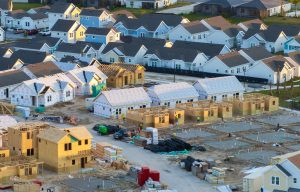 Aerial view of homes under construction in a residential development.